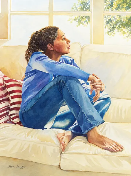 Seated figure in blue on a sofa.